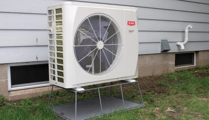 A heat pump installed outside a home. 