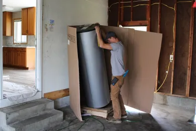 A contractor unboxing building materials.  